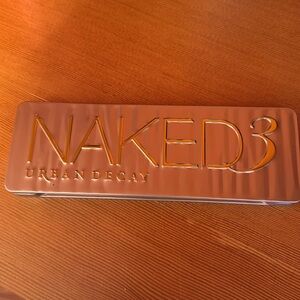 Urban Decay Naked 3 eyeshadow palette, lightly used.